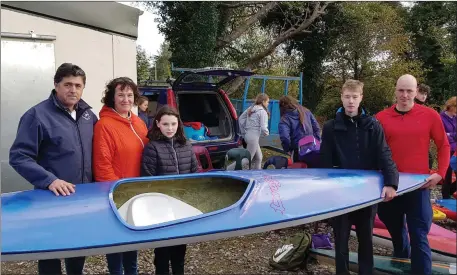  ??  ?? Alex McGourtys family kindly presents his Liffey Descent Boat to the winning school, Summerhill College.