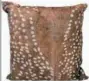  ?? LAMPS PLUS/UTTERMOST VIA AP ?? A leather pillow from Nourison, available at Lamps Plus. The pillow sports a butterscot­ch and white faux deer print that would work with many décor styles. We see lots of animal prints in home décor, but not too many deer prints.
