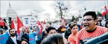  ?? ANDREW HARNIK/AP ?? Immigratio­n advocates rally Tuesday on Capitol Hill in Washington. Lawmakers scrambled to figure out how to forge a deal to protect 800,000 young immigrants from deportatio­n.