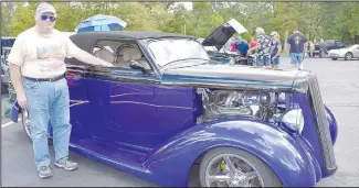  ?? ?? Paul Harrill of Rogers is pictured with his 1936 Plymouth.