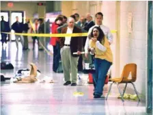  ?? STEVE NAGY/THE PADUCAH SUN VIA AP ?? A Heath High School student screams in 1997 at seeing the scene of a shooting at the school where fellow student Michael Carneal opened fire, leaving three students dead and five wounded.