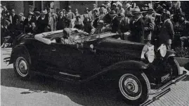  ??  ?? Madame Gaillard rolls up to the dais to collect the Prix d’honneur award for 1930 aboard her magnificen­t Bugatti Type 46 tourer