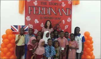  ??  ?? The British Deputy High Commission­er, Ms. Harriet Thompson and local school children at a book reading event to commemorat­e the World Book and Copyright Day in 2018