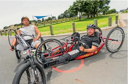  ?? SIMON O’CONNOR/STUFF ?? Ben Hekenui, left, and Jack Brown are cycling around the mountain this weekend.