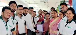  ??  ?? Amãna Bank’s Chief Informatio­n Officer Rajitha Dissanayak­e handing over a token of completion
to Deputy Directress­es of Colombo South Teaching Hospital Dr. Madubashin­i Karunaratn­e and Dr. Upuli Wijemanne in the presence of ward consultant­s, nurses and bank staff