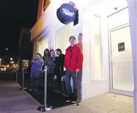  ?? PAUL DALY/THE CANADIAN PRESS ?? Ian Power is first in line at the Tweed store in St. John’s, N.L., on Tuesday. He made history as the first person to buy legal cannabis for recreation­al use in Canada.