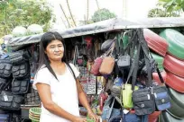  ??  ?? Irene Vecino shows her rolling store which is a product of the City’s Self-Employment Assistance Program.