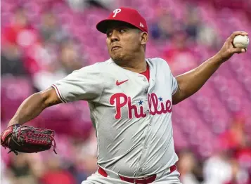  ?? CAROLYN KASTER / AP ?? Phillies starting pitcher Ranger Suárez throws in the first inning against the Reds on Monday in Cincinnati. Suárez allowed two hits over seven innings as the Phillies handed the Reds their first shutout this season.