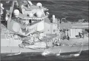  ?? Iori Sagisawa/Kyodo News via AP ?? The damage of the right side of the USS Fitzgerald is seen off Shimoda, Shizuoka prefecture, Japan, after the Navy destroyer collided with a merchant ship. The U.S. Navy says the USS Fitzgerald sustained damage below the water line on its starboard...
