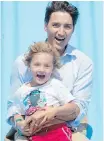  ?? CP ?? Prime Minister Justin Trudeau and son, Hadrien, 4, on the Super Slide in Charlottet­own on Monday.