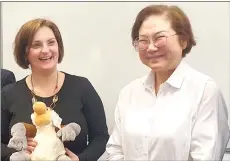  ?? ?? Dr Fazekas (left) with Liew after receiving a proboscis monkey plush toy from the latter.