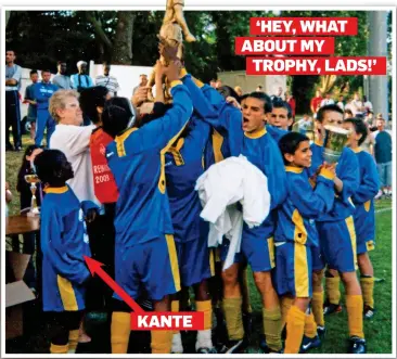 ??  ?? SMALL BEGINNINGS: Jeunesse Sportive de Suresnes players celebrate their tournament success and the player of the tournament trophy, completely forgetting it was won by the little boy standing behind them — N’Golo Kante (circled, and bottom row far...