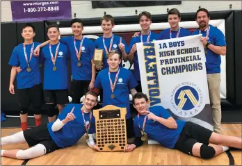  ??  ?? The Senator Gershaw Gators boys volleyball team celebrates a 1A championsh­ip win in Bashaw Saturday night.