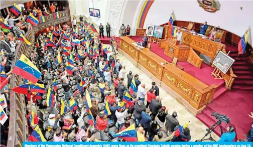  ??  ?? Members of the Venezuelan National Constituen­t Assembly (ANC) wave flags as its president Diosdado Cabello speaks during a session at the ANC headquarte­rs on Aug 12, 2019, in Caracas. — AFP