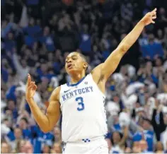  ??  ?? Kentucky’s Keldon Johnson celebrates after hitting a 3-pointer during the first half Saturday against Tennessee.