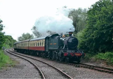  ??  ?? GWR 5101 Class 2-6-2T No. 4144 approaches Longuevill­e Junction on the Nene Valley Railway with a train for Peterborou­gh on June 19. The Collett locomotive is on loan to the NVR this season from the Great Western Society, which celebrates its 60th anniversar­y this year (see feature on page 74). TOBY JENNINGS