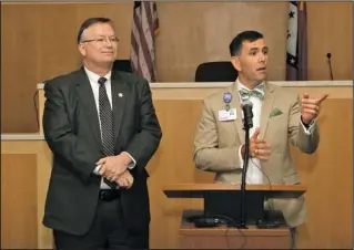  ?? The Sentinel-Record/Richard Rasmussen ?? ADDRESSING THE ISSUE: Garland County Sheriff Mike McCormick, left, and CHI St Vincent Hot Springs President Tony Houston field questions Wednesday at a news conference at the Garland County Detention Center announcing a law enforcemen­t officer suicide...