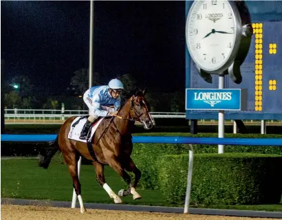  ?? — Photo by Leslie Pableo ?? Heavy Metal, ridden by Royston Ffrench, winning the fourth race at the Meydan Racecourse on Thursday.