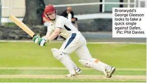  ??  ?? Bronwydd’s George Gleeson looks to take a quick single against Dafen. Pic: Phil Davies