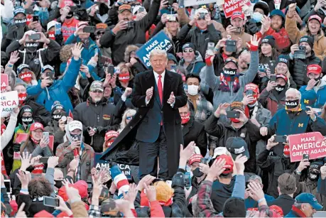  ?? CARLOS OSORIO/AP ?? President Trump arrives at a campaign rally Saturday in Norton Shores, Michigan, a state that may be slipping from him.