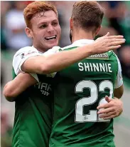  ??  ?? ALL SMILES: Fyvie hails Shinnie after he opened his account for Hibs as they kept up their early season form