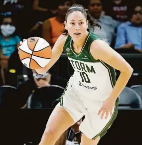  ?? Matt York / Associated Press ?? Seattle Storm guard Sue Bird brings the ball upcourt during the first half of the Commission­er’s Cup against the Connecticu­t Sun on Aug. 12 in Phoenix.