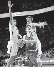  ?? AP/JOHN BAZEMORE ?? Duke guard Grayson Allen (3) drives between Georgia Tech guard Tadric Jackson (1) and Georgia Tech center Ben Lammers (44) Sunday in Atlanta. Allen scored 23 points as the Blue Devils won 80-69.