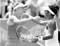  ?? - AFP photo ?? Denmark’s Caroline Wozniacki (L) celebrates after beating Britain’s Heather Watson in a women’s semi-final tennis match at the ATP Aegon Internatio­nal tennis tournament in Eastbourne, southern England, on June 30, 2017.