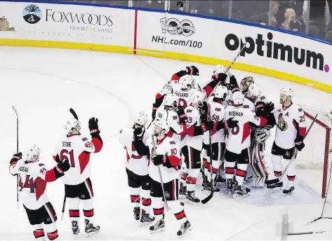 ?? PHOTOS: FRANK FRANKLIN II/THE ASSOCIATED PRESS ?? The Ottawa Senators celebrate after beating the New York Rangers 4-2 in Game 6 of their second-round playoff series on Tuesday in New York. With the win, the Senators advance to the Eastern Conference final to play Washington or Pittsburgh.