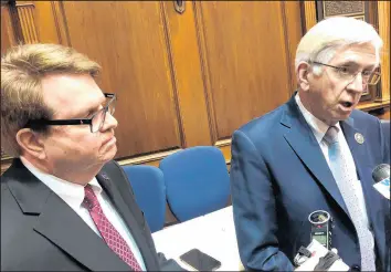  ?? TOM DAVIES/AP ?? State Rep. Ed DeLaney, D-Indianapol­is, right, speaks to reporters with House Minority Leader Phil GiaQuinta, D-Fort Wayne, on the House floor on Thursday in Indianapol­is.