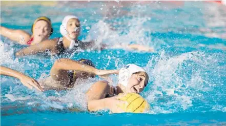  ?? JENNIFER LETT/STAFF PHOTOGRAPH­ER ?? Hialeah’s Ashley Luy scored five goals during the girls’ waterpolo semifinals at the Ansin Aquatic Center in Ransom Everglades School in Miami on Friday.