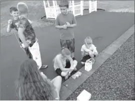  ?? Photo by Jessica Decker ?? Kids tasting baby food at one of the stations during the Fox Township Park Summer Program last week.