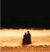  ??  ?? This file photo shows two veiled Saudi women enjoy the Red Sea at night, in Jiddah, Saudi Arabia.