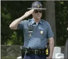  ?? ?? State Police Lt. Reid Bagley salutes during the playing of the national anthem.