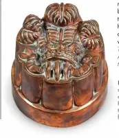  ?? ?? LEFT L Part of the Annie Marchant collection c of domestic and country antiques, a a 19th-century Benham & Froud copper jelly mould, featuring the Prince of Wales feathers, sold for £533.