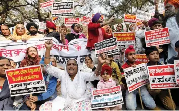  ??  ?? Family members of the victims of 1984 anti- Sikh riots protest against senior Congress leaders Jagdish Tytler and Sajjan Kumar in New Delhi on Friday. — BUNNY SMITH