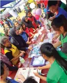  ??  ?? Students show their entreprene­urial skills at the drinks stall which was well-patronised.