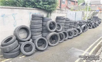  ??  ?? DUMPED: The mountain of fly-tipped tyres.