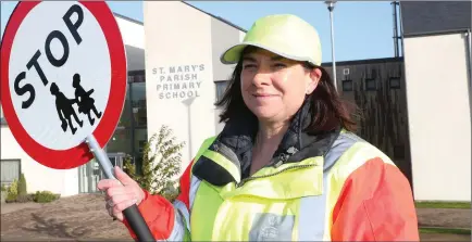  ??  ?? Kerry Coyle pictured on her last day as the lollipop lady at St. Mary’s school.