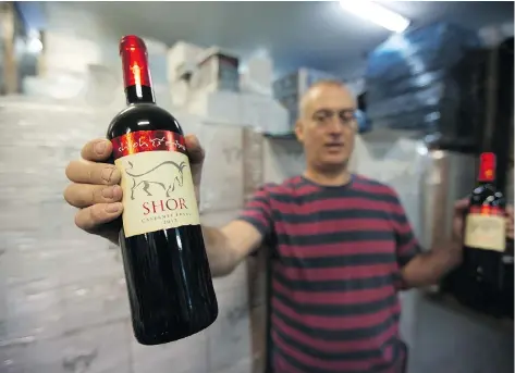  ?? MENAHEM KAHANA / AFP / GETTY IMAGES ?? Wines produced in the Jewish settlement of Shilo in the occupied West Bank were some of the products affected by a Canadian Food Inspection Agency proclamati­on — which has since been revoked — stating products from the disputed region could not be...