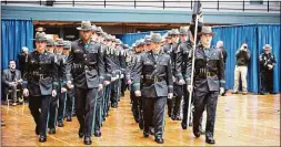  ?? Connecticu­t State Police / Contribute­d photo ?? The Connecticu­t State Police recently graduated 53 new state troopers, all members of the 131st Training Troop, at the Hartford Armory. Four are assigned to the Westbrook Troop F barracks. The latest subject of debate in Connecticu­t’s increasing­ly contentiou­s gubernator­ial election: a listicle from the website WalletHub.