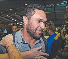  ?? WELL DONE: Cowboys centre Justin O'Neill arrives back at the airport yesterday. Picture: ZAK SIMMONDS ??