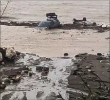  ?? ?? aestroyed cars are pictured in the sea in Casamiccio­la in the southern Ischia islandI following heavy rains that sparked a landslide.