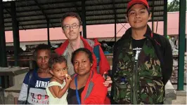  ?? ?? Successful trip: Mr Smith with locals in West Papua, Indonesia