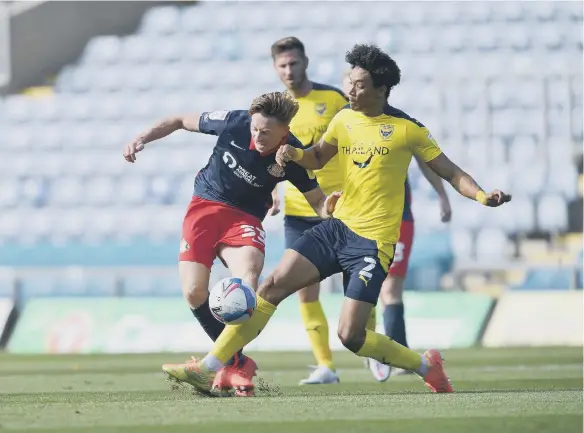  ??  ?? Denver Hume looks to beat his marker on the way to Sunderland gaining three points.