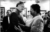  ?? JESSICA MCGOWAN/GETTY ?? The Rev. Jesse Jackson, an activist, greets gubernator­ial candidate Stacey Abrams on Tuesday at a cafe in Atlanta.