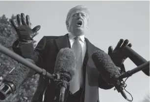  ?? AP PHOTO/CAROLYN KASTER ?? President Donald Trump talks to members of the media outside the White House Saturday before heading to Philadelph­ia for the Army-Navy football game.