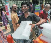  ?? ?? A street vendor in Dhaka sells ice on May 10 as scorching temperatur­es hit Bangladesh. Temperatur­es between 36 C and 41 C were recorded across the South Asian country, exceeding typical highs for May, according to media reports.