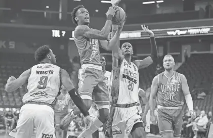  ?? ETHAN MILLER/GETTY IMAGES ?? Ron Holland (with ball) plays for the G League Ignite and is expected to be a first-round NBA draft pick.