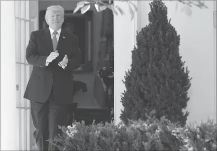  ?? The Associated Press ?? President Donald Trump walks out of the Oval Office before an event with university student-athletes at the White House, Friday.